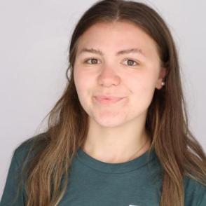 Student smiles for a professional portrait