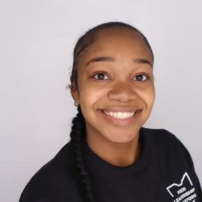 Student smiles for a professional portrait