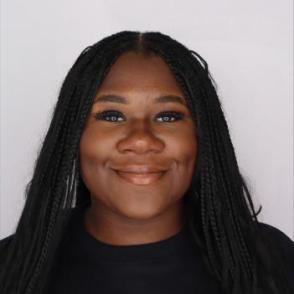 Student smiles for a professional portrait