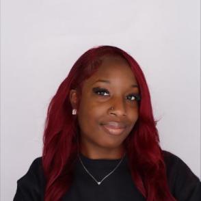 Student smiles for a professional portrait