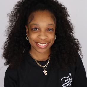 Student smiles for a professional portrait