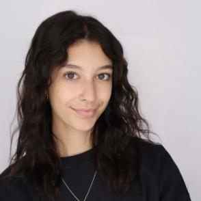 Student smiles for a professional portrait