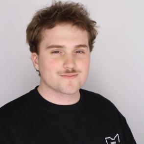 Student smiles for a professional portrait