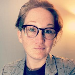 Headshot of Megan Rookard wearing glasses and blazer