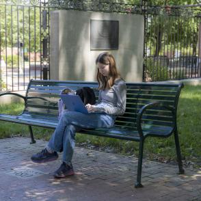 Student studying on College Green