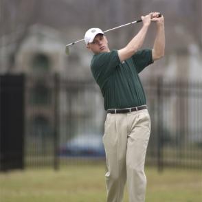 person playing golf at golf course