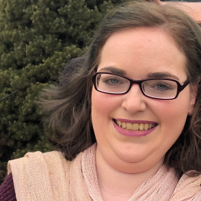 Portrait of graduate Lauren Huff smiling outdoors