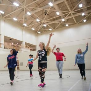 group of students dancing together in cardio dance class