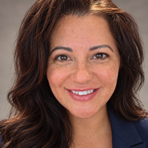 Smiling woman with wavy dark hair