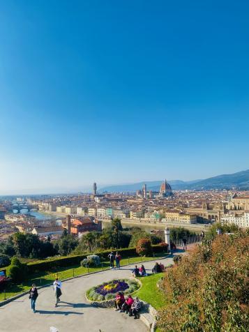A scenic photo of a winding road under a blue sky in Florence