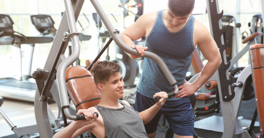 two young men in fitness center