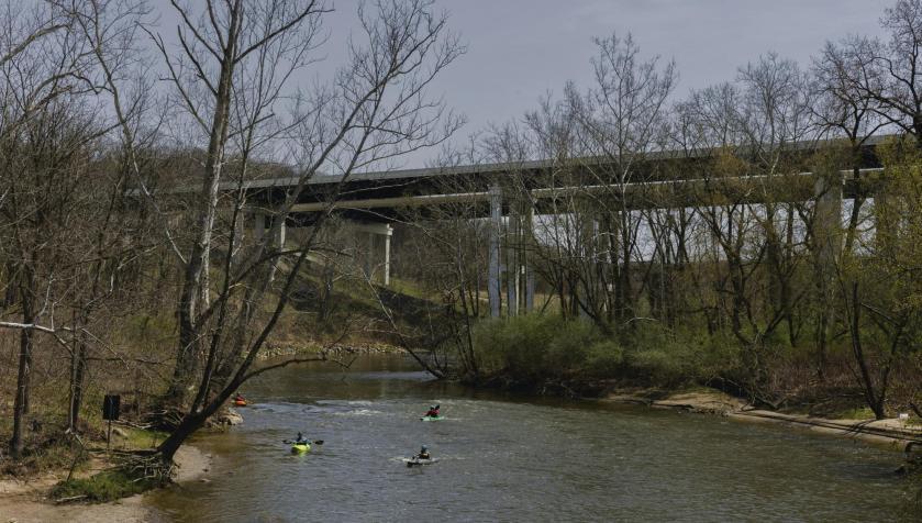 Kayakers go down the Cuyahoga River in Boston, Ohio, April 20, 2025. Nearby, data centers have been built around Akron, Ohio.