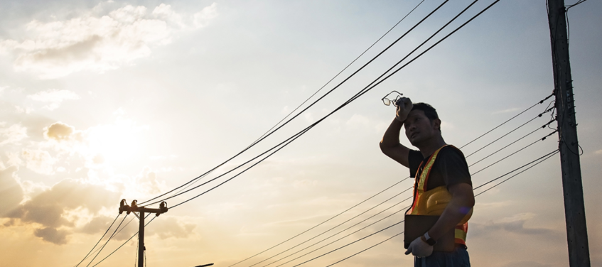 sweating electricity grid worker