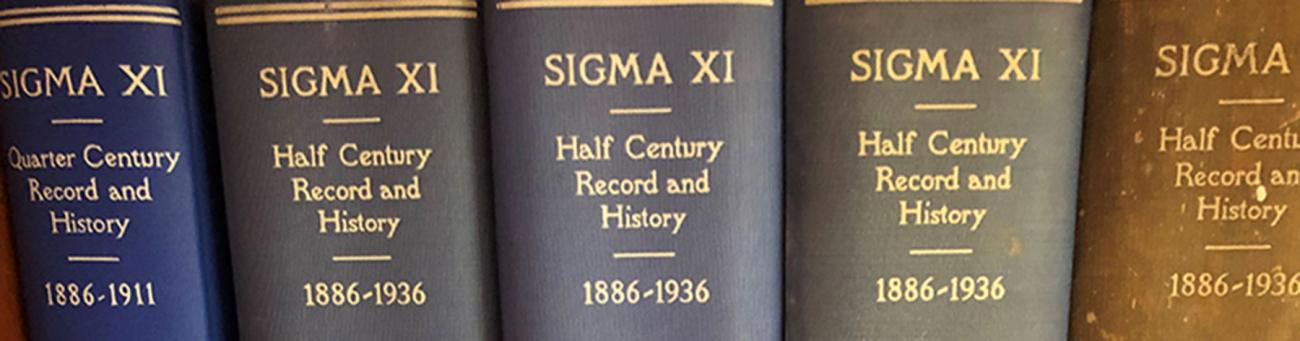 Multicolored row of books titled "Sigma Xi: Half Century Record and History: 1886-1936"