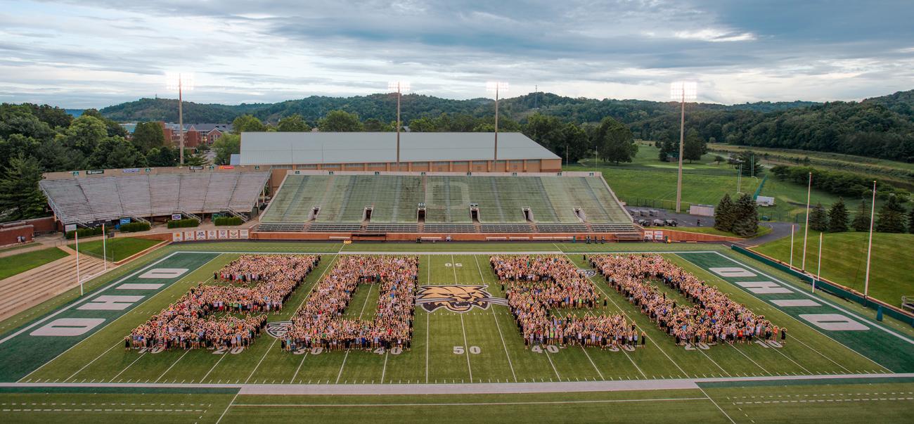 The class of 2020 forms "2020" on the Ohio University football field
