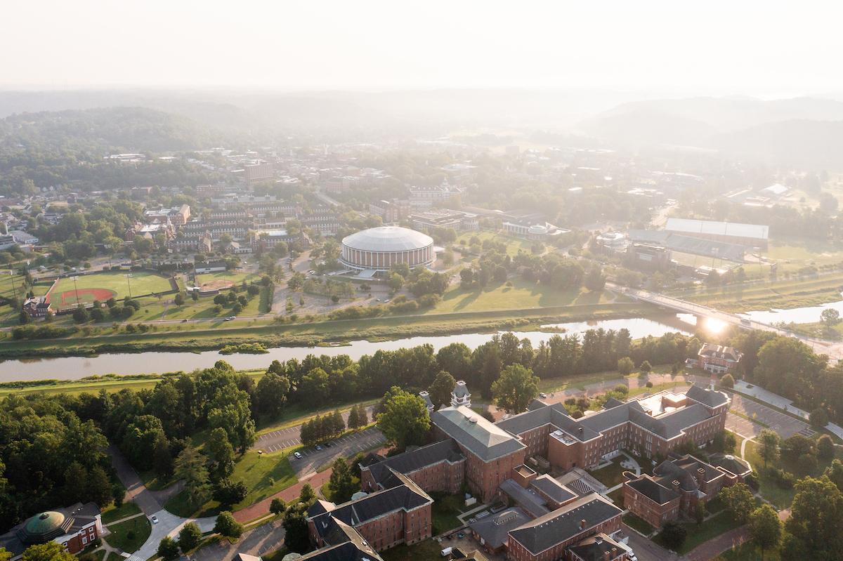 An aerial view of Ohio University's Athens campus, with The Ridges buildings across the river