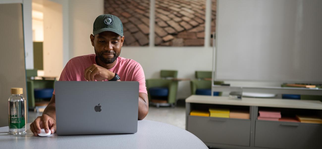 An Ohio University student works on their laptop