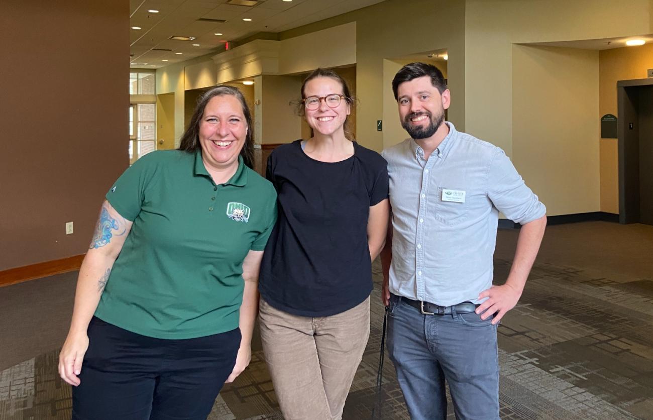 Three Ohio University staff/faculty members smile for a picture