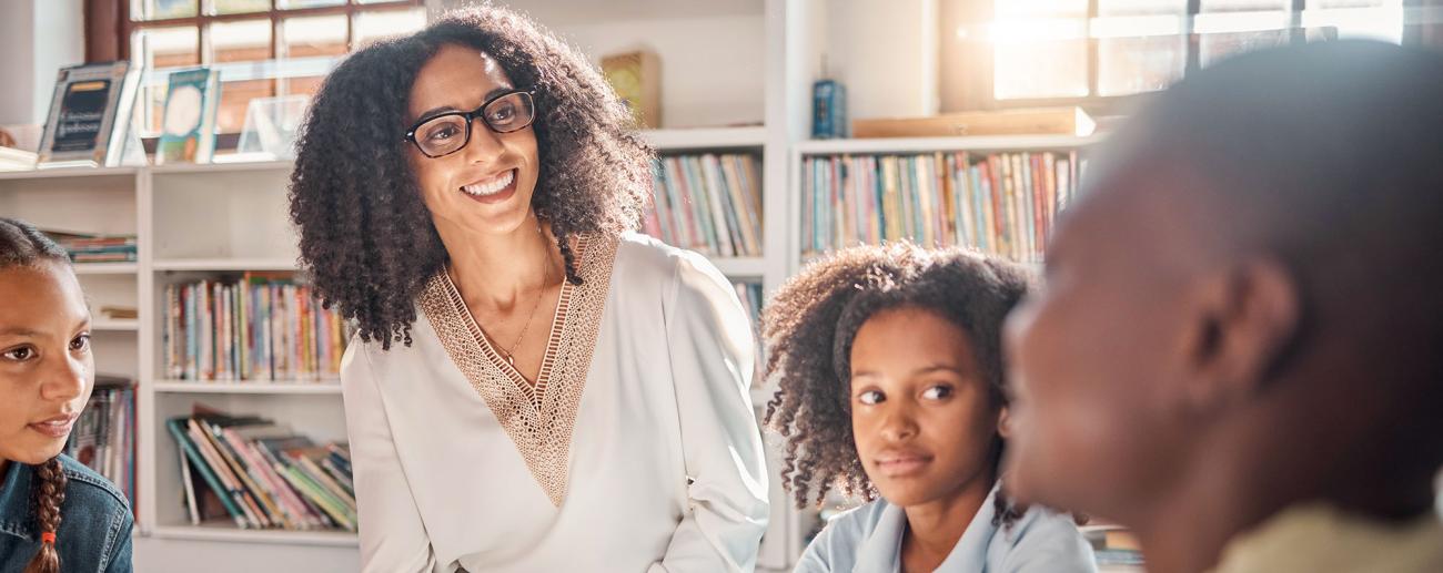 Young teacher leading group reading session