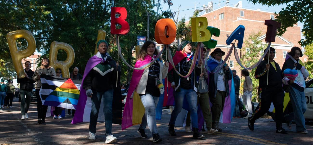Students walk in homecoming parade in support of lgbtqia