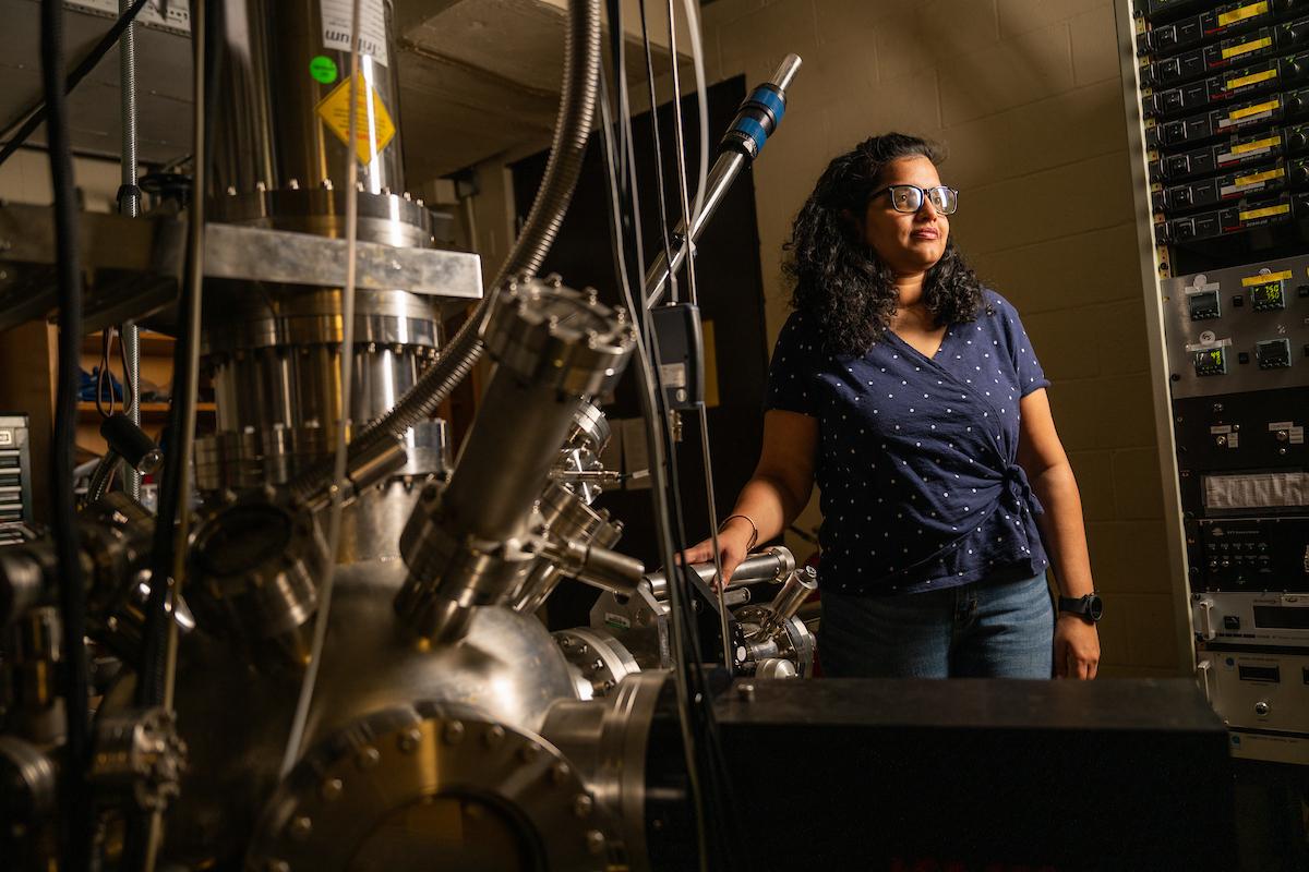 Physics student poses with equipment at Ohio University