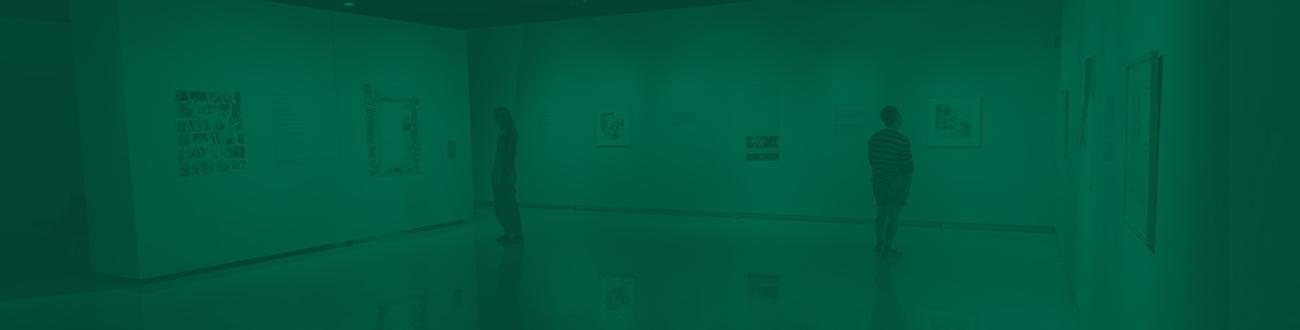 two people looking at art in a gallery