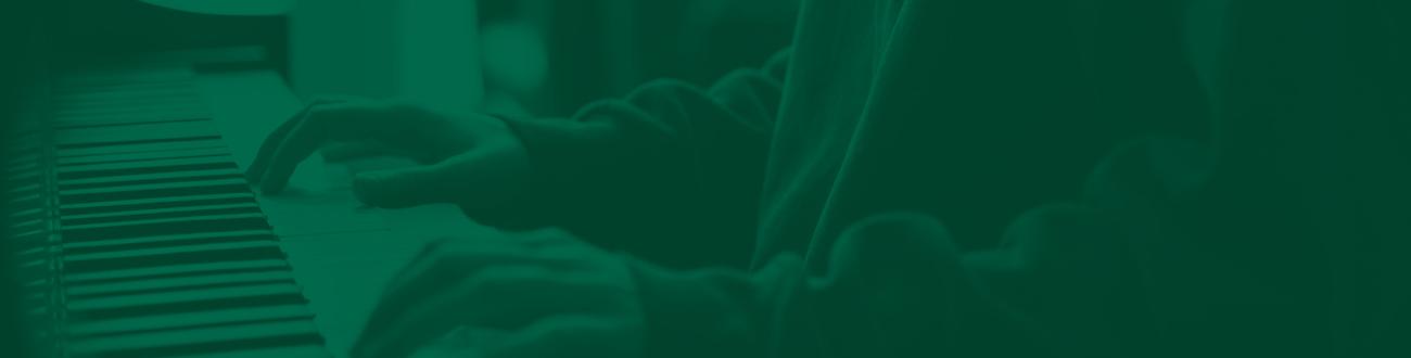 close up of hands playing piano 