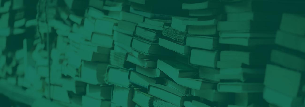 Closeup of book bindings stacked on a shelf