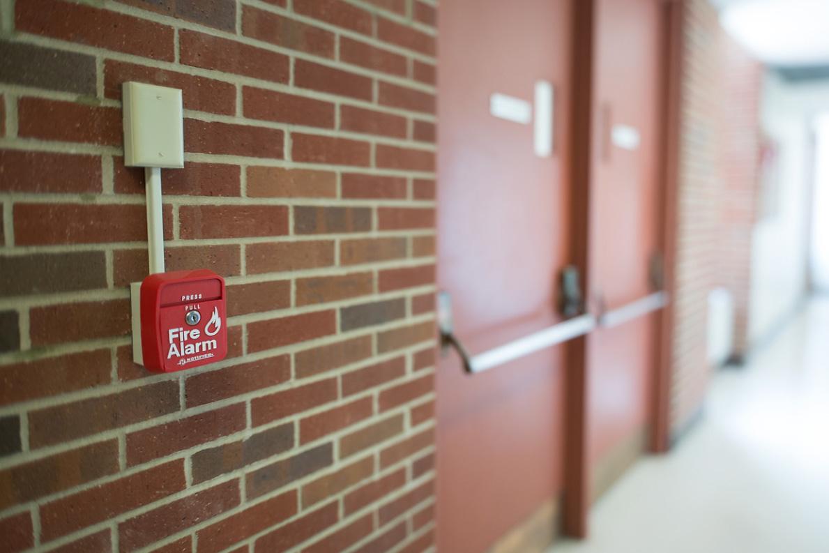Fire alarm on a brick wall