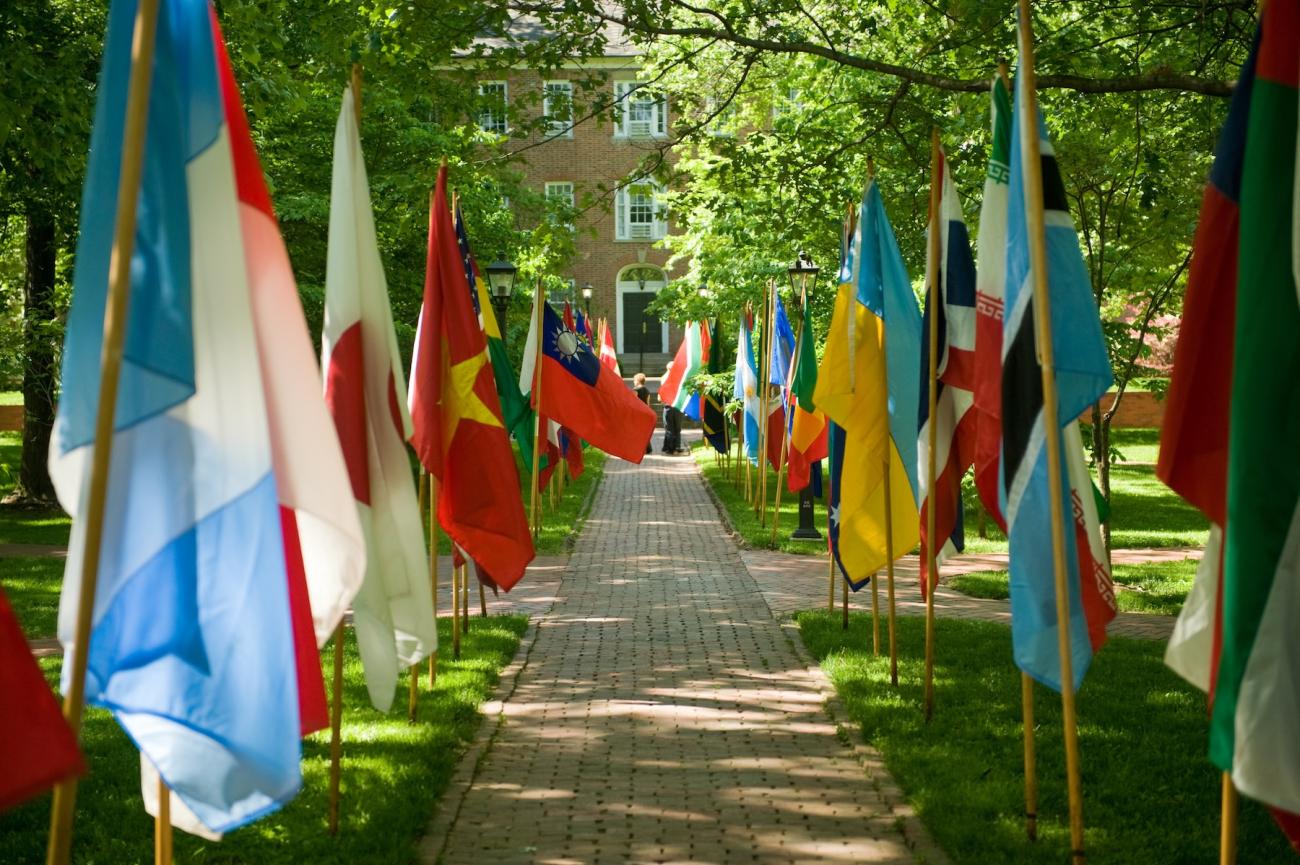 lines of flags lining the pathway to Cutler Hall