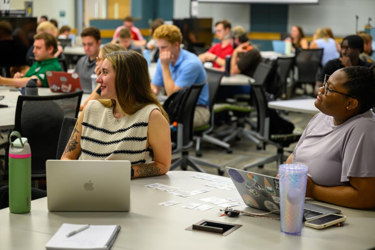 group of students smiling in class