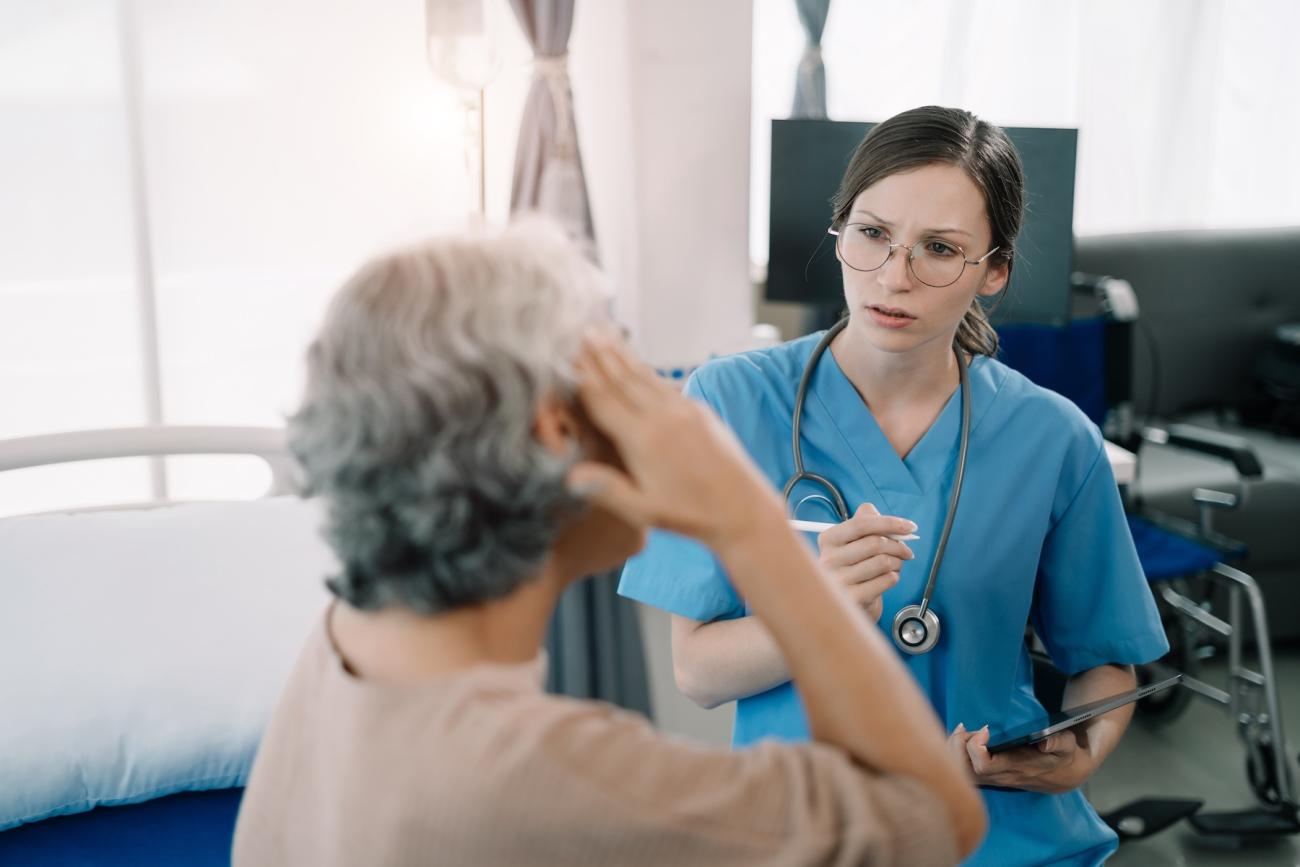 nurse talking to an elderly woman