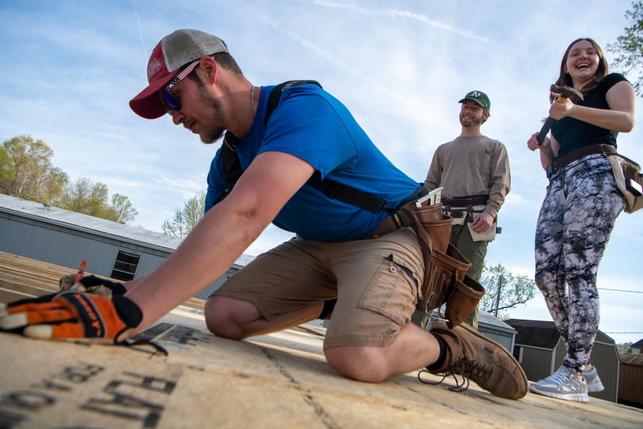 Students working on a Habitat for Humanity build site