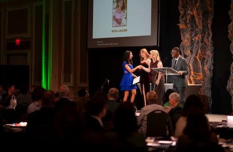 student receiving an award on stage