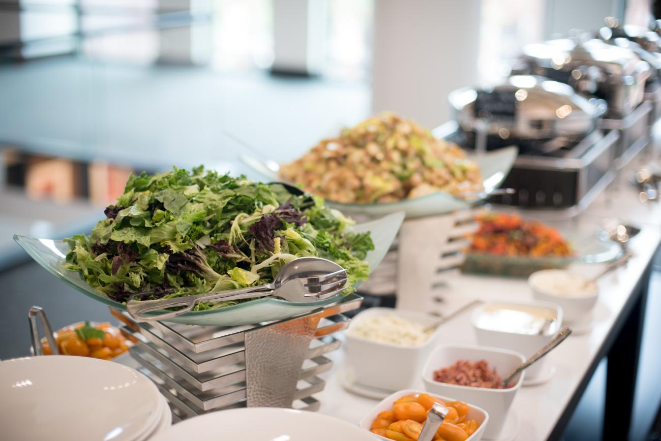 salads and catered food being served buffet style