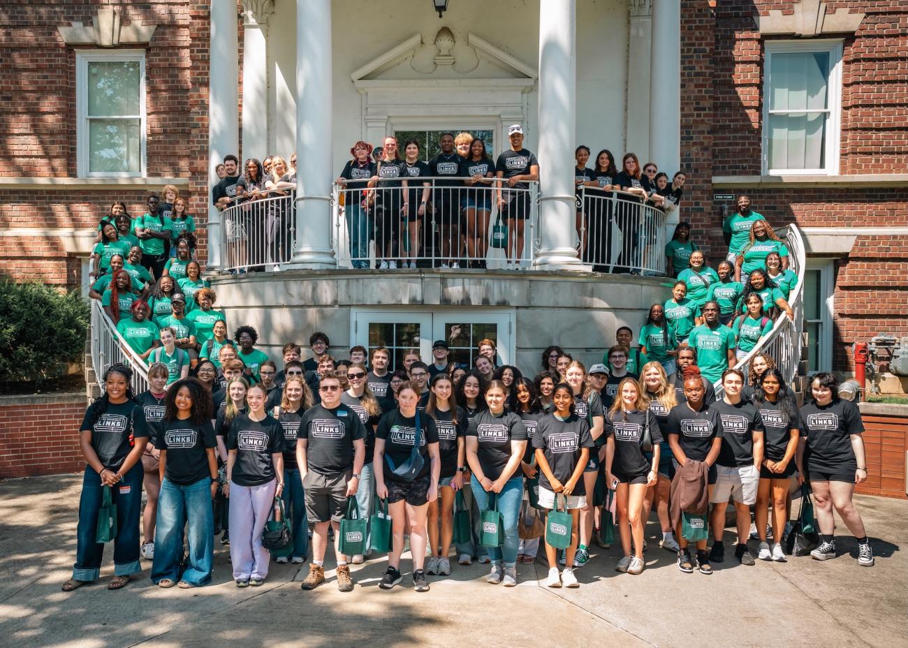 group of LINKS students and peer mentors gather in front of Ellis Hall