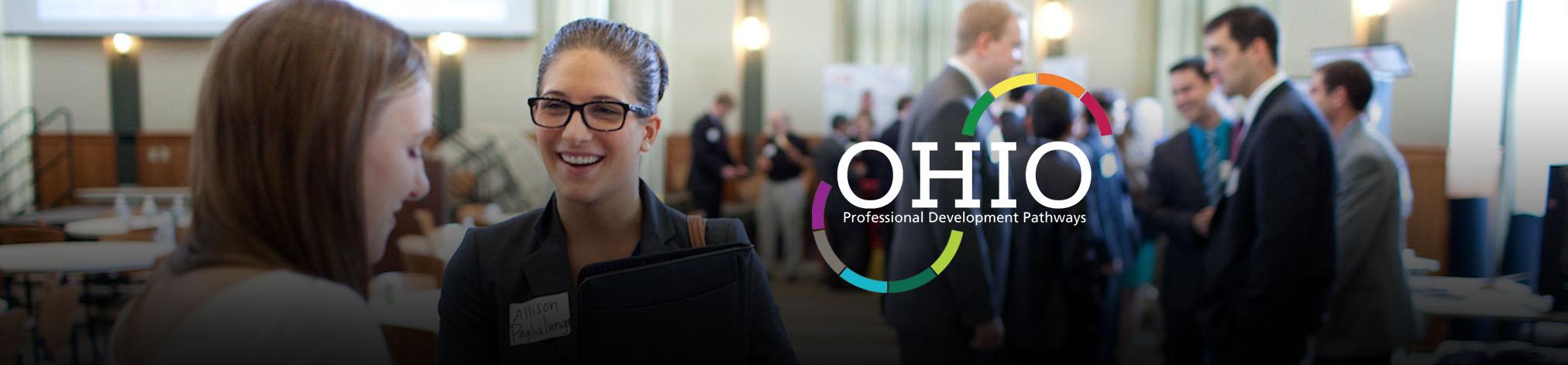 people attending an event and the professional development logo