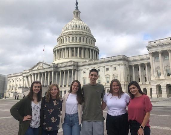 Photo of students on the capital internship program in front of the capital building