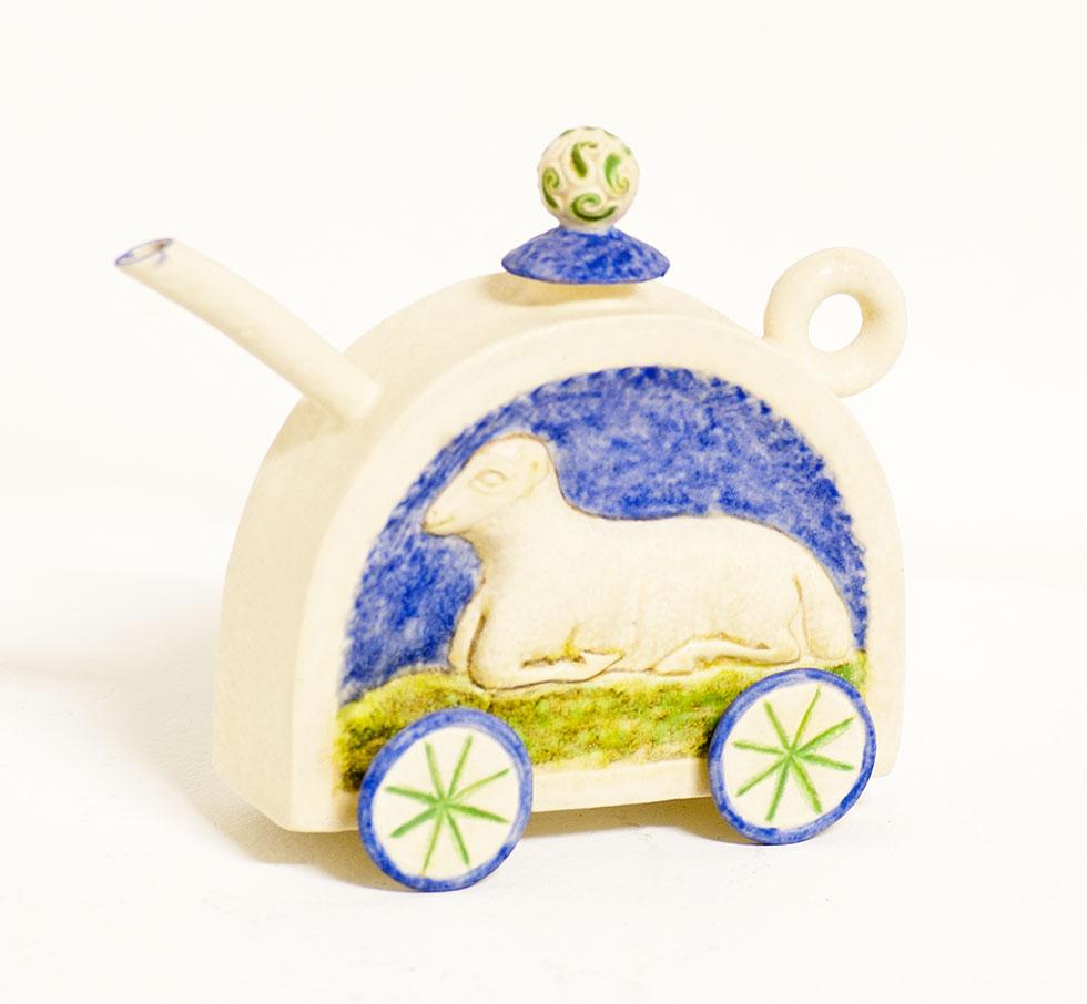 Lamb on Wheels, 1995, Marian Haigh, hand-built and cast ceramic with glazes, 5 in. x 5.25 in. x 2.5 in. (12.7cm x 13.3cm x 6.4cm), 97.007.1.