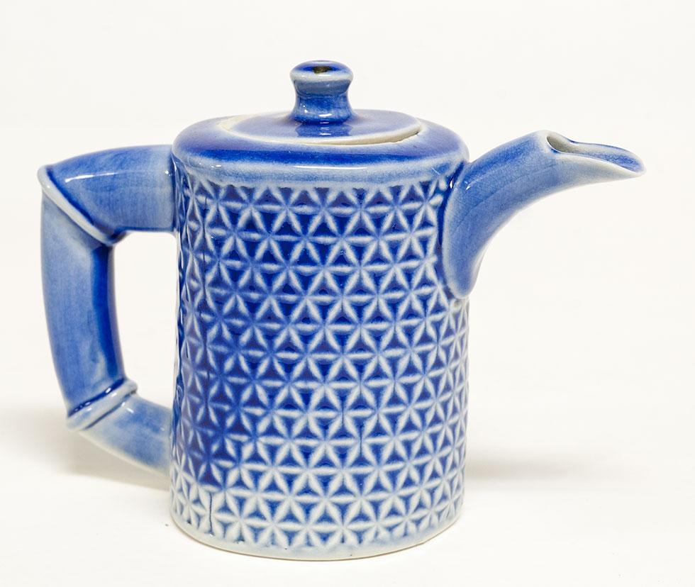 Teapot, 1995, Jeffrey Alan Kochert, porcelain and glaze, 4.5 in. x 6 in. x 2.75 in. (11.4cm x 15.2cm x 7cm), 97.009.1. Gift of the artist.