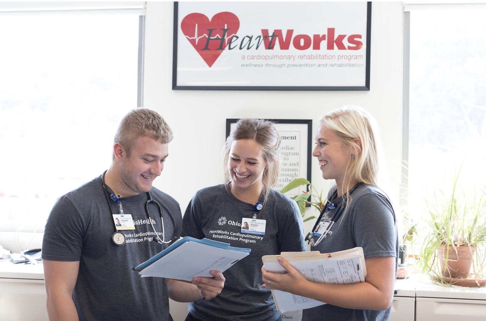 Exercise Physiology Graduate Students in front of HeartWorks sign