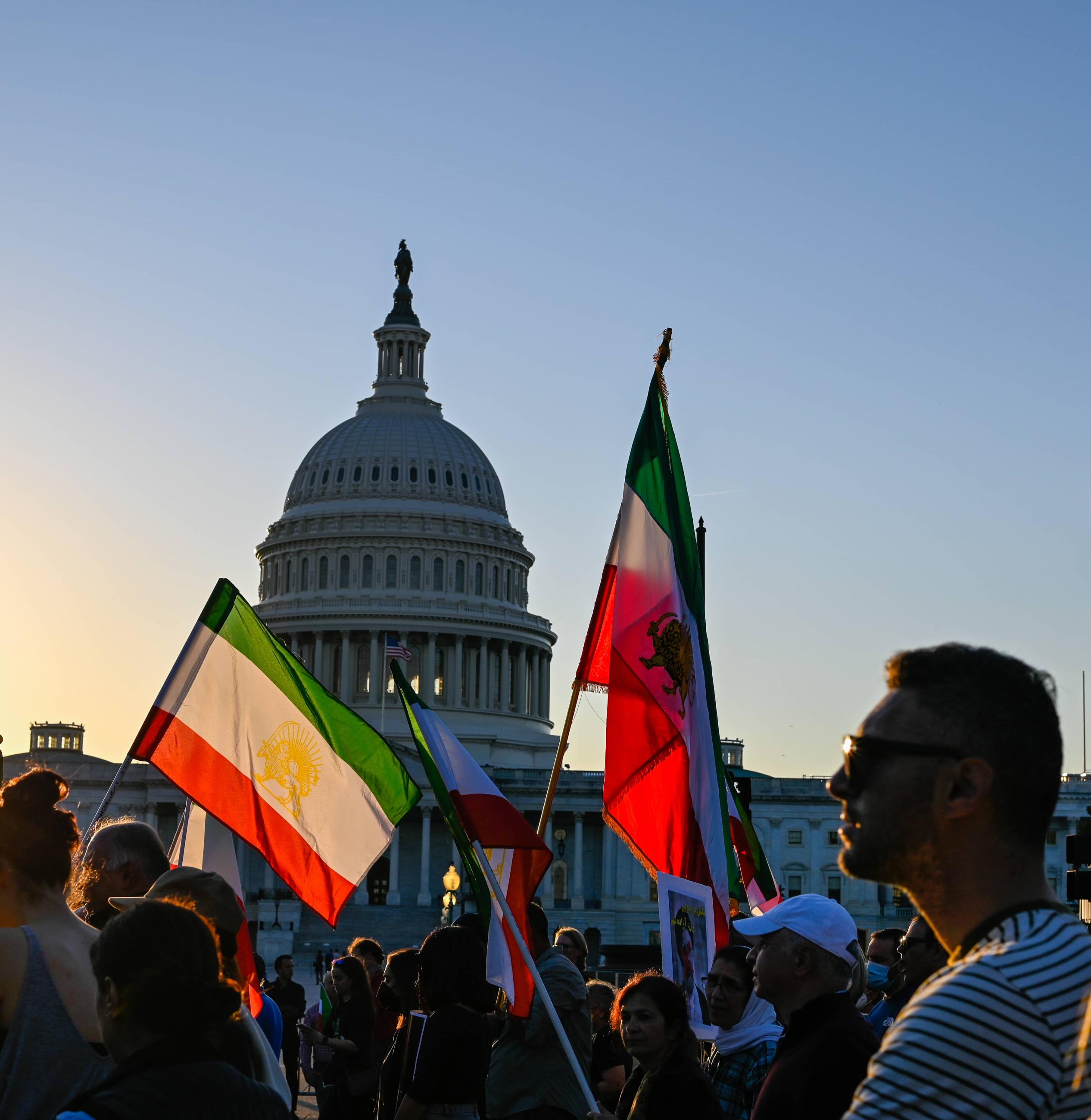 Washington, D.C.: Iranian flags fly past the United States Capitol as Marchers make their voice heard for Iran and the citizens who lost internet access.