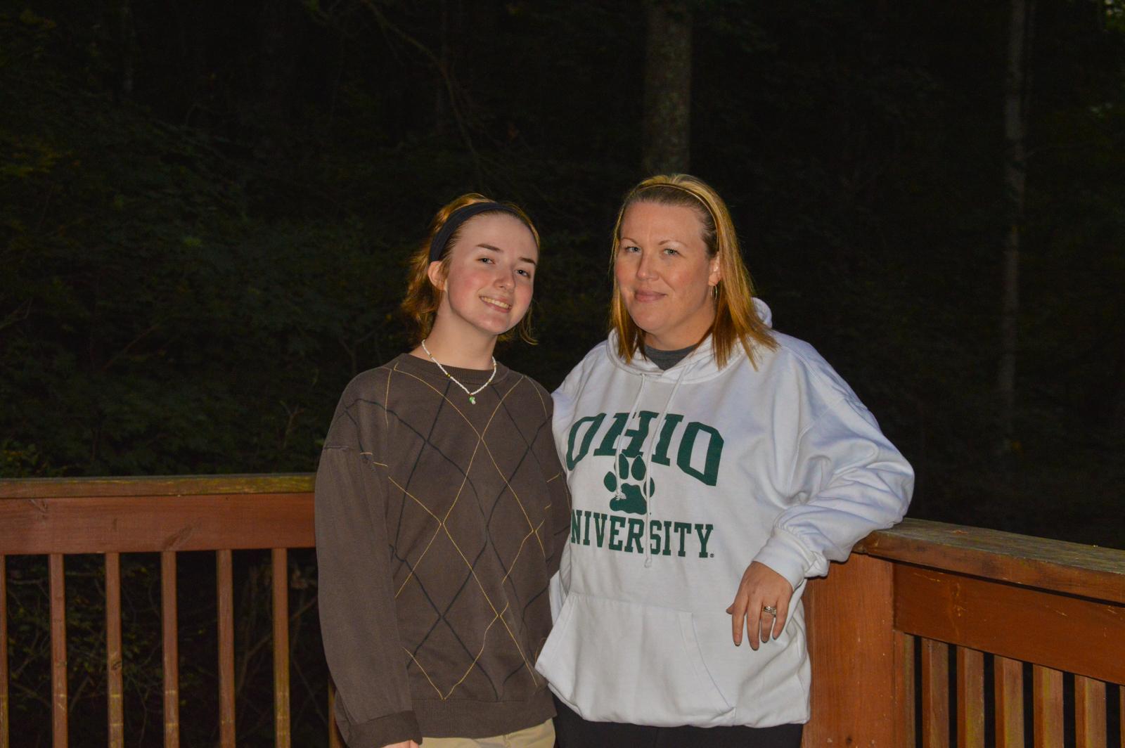 Hocking Hills, Ohio: On parents weekend 2022, my family all went to stay at a cabin in Hocking Hills. My mom who is photographed in the Ohio University sweatshirt, went to Ohio University. My sister, who is photographed next to my mom, is planning on attending Ohio university In the fall of 2023. I am the one taking this photo, who is currently attending Ohio University. We all have gone on different paths to get to this point, and Ohio University has played a role in that in each of our