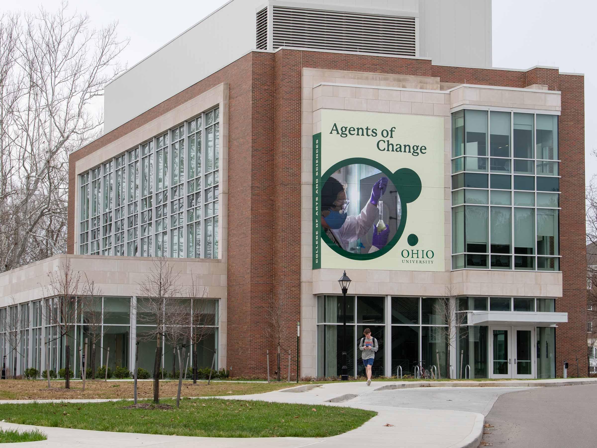 large billboard banner applied to Chemistry building promoting the College of Arts and Sciences