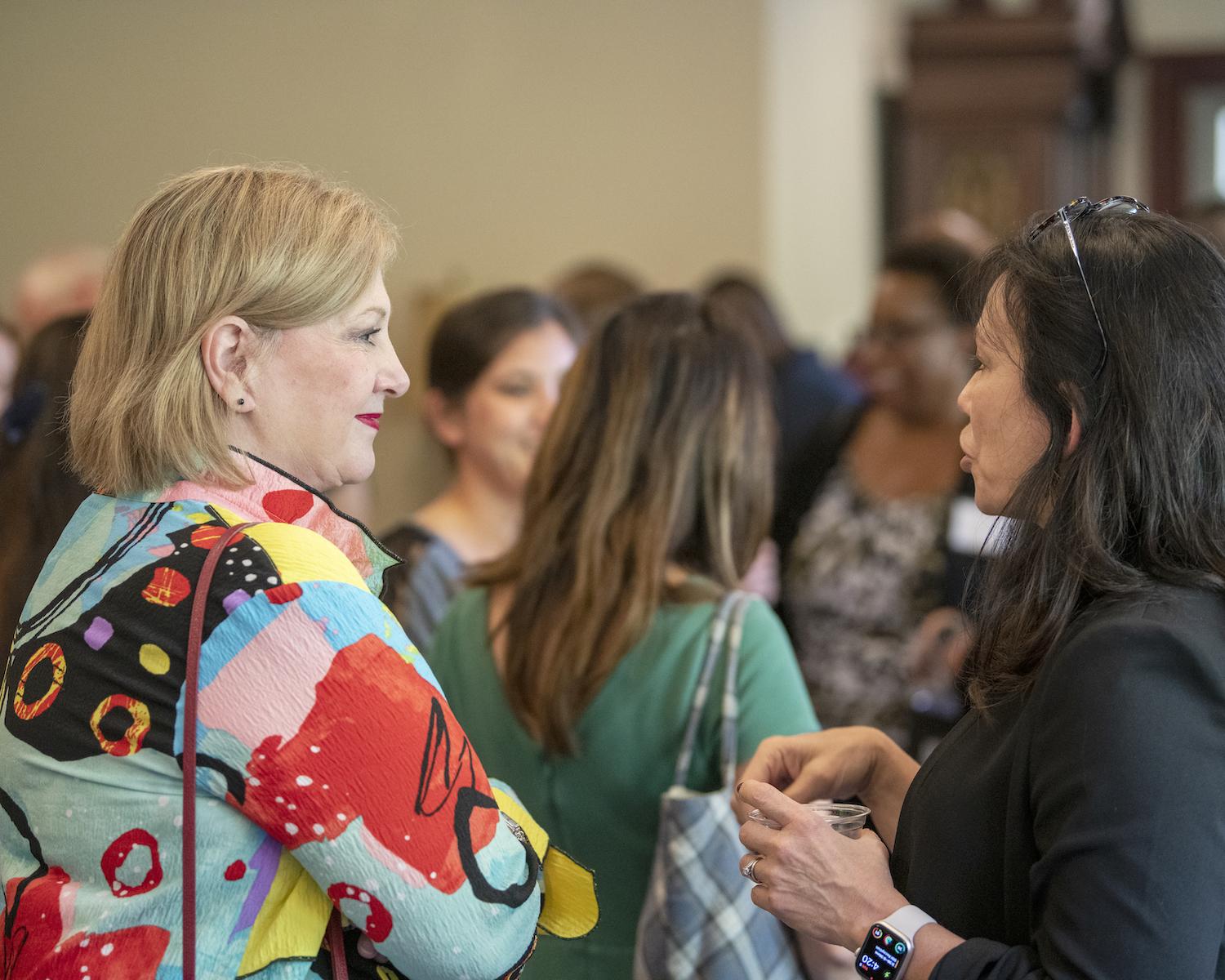 Individuals mingle  at the Fall 2023 Mix and Mingle for faculty and staff 