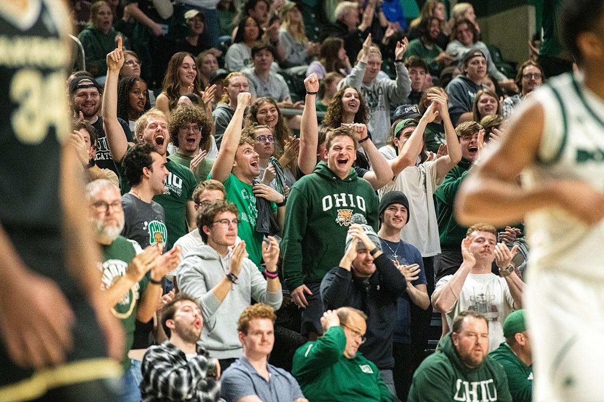 The Ohio student section reacts to a big play during a basketball game