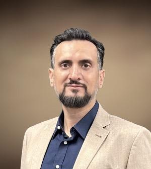 Laeeq Khan posing for a simple headshot photo