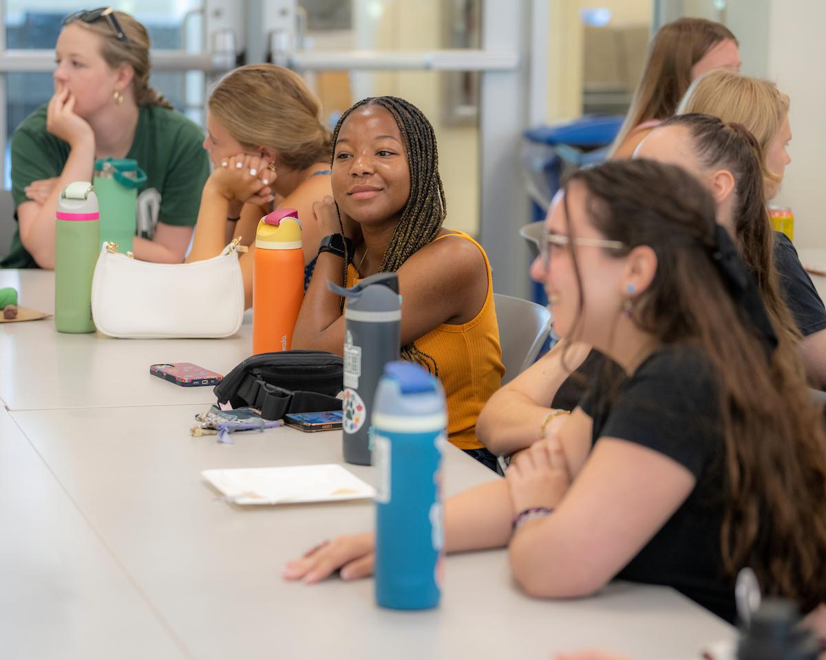 Students listening to a presentation at the Early Experience program
