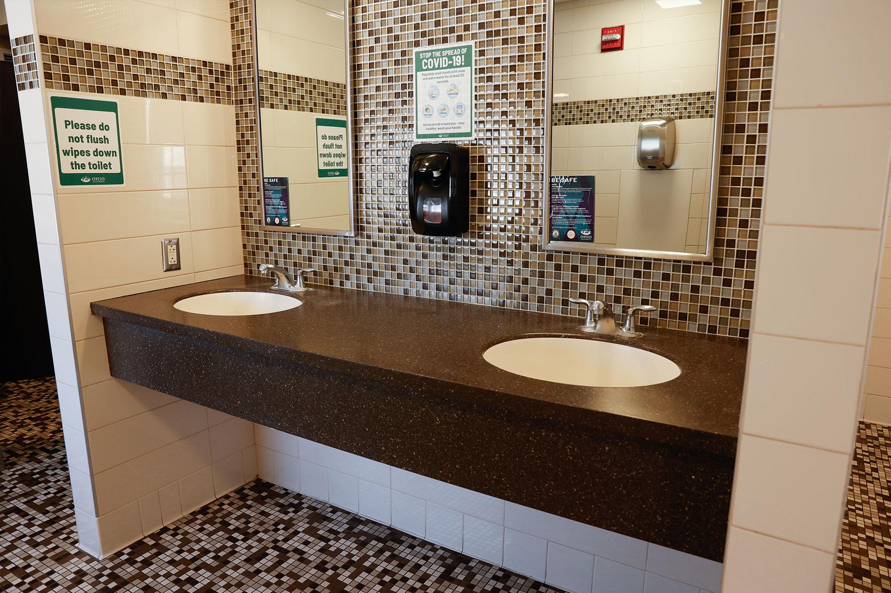 Inside Boyd Hall's bathrooms for students, showing a sink area with a mirror