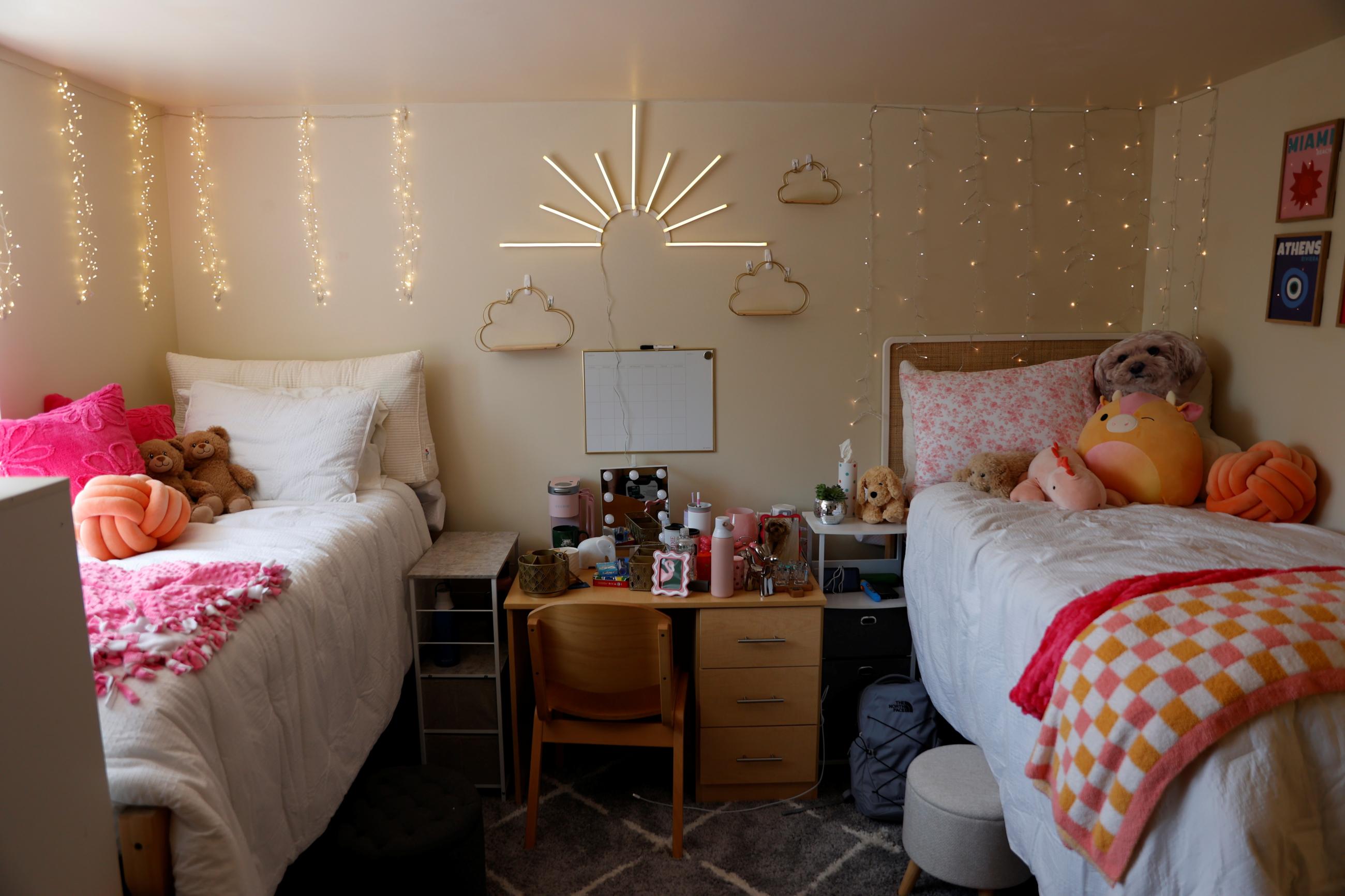 decorated double room with white and pink bedding